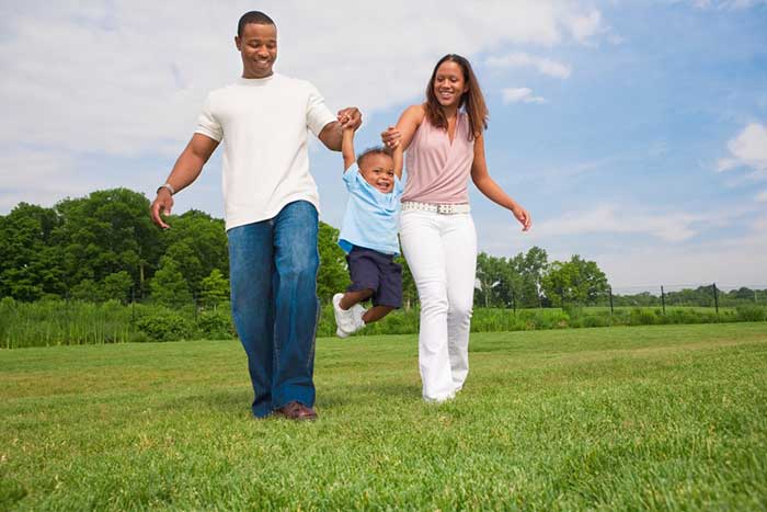 Small kid enjoying with his parents