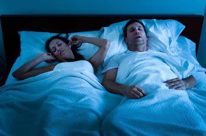 Husband and wife sleeping