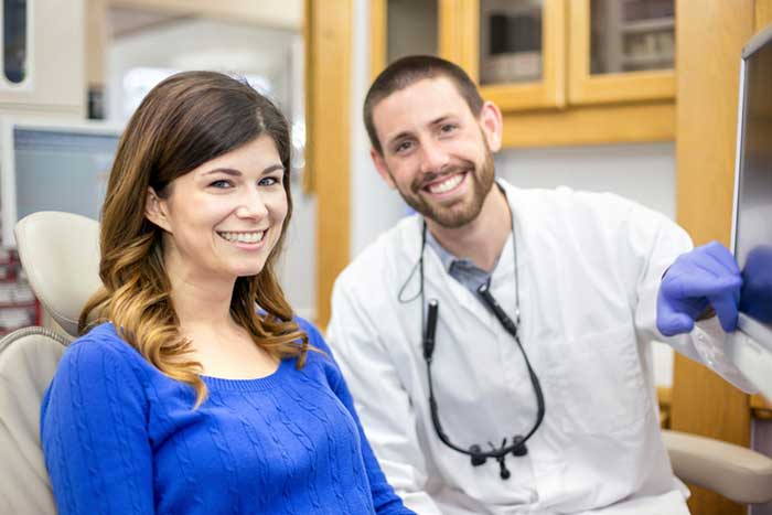 Happy patient with dentist