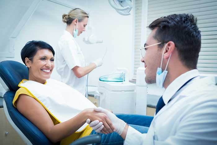 Dentist treating the patient
