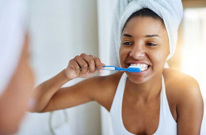 A girl brushing her teeth