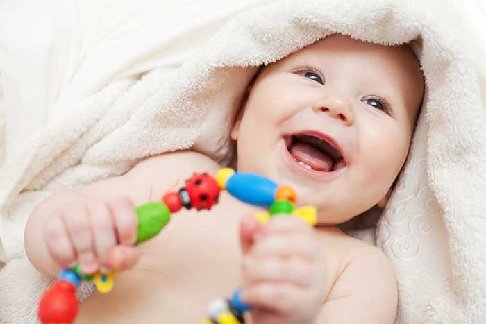 Baby playing with a toy